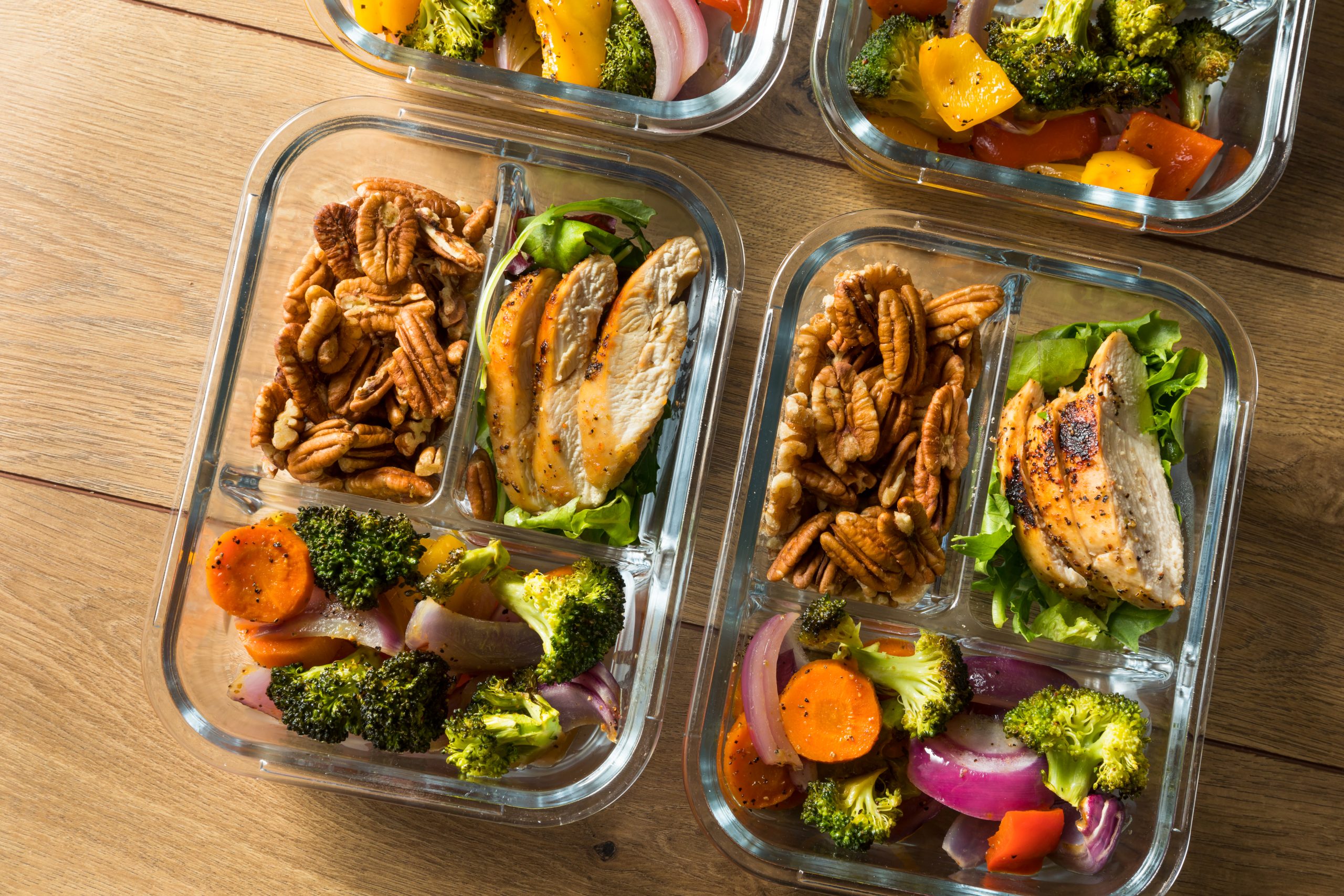 Prepared meal containers with balanced portions of protein, grains, and vegetables